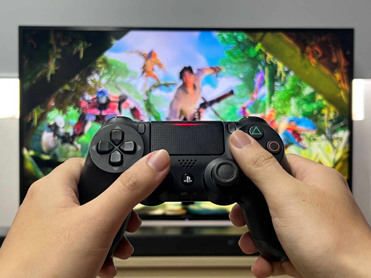PS4 controller with the Fortnite game on the Sony TV