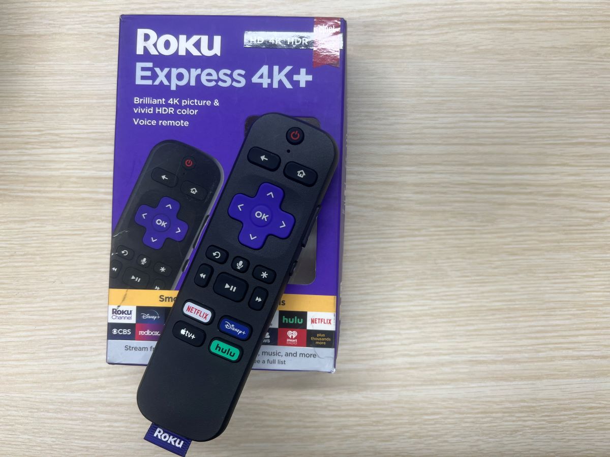 a roku remote placed on its box