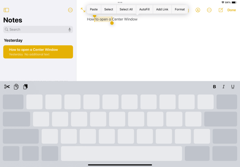 Keep one finger on the keyboard, use a second finger to press and hold the keyboard. Move your first finger around the keyboard to adjust the selection highlight