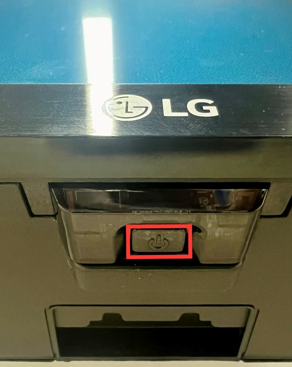 power button on an lg tv is highlighted