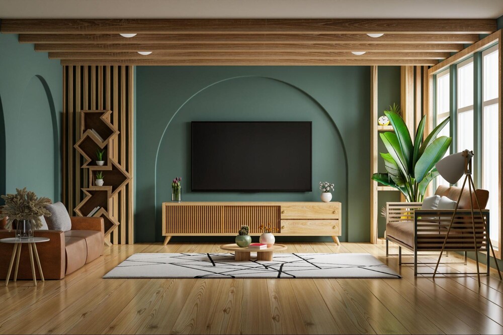 wall mounted tv above a wooden cabinet