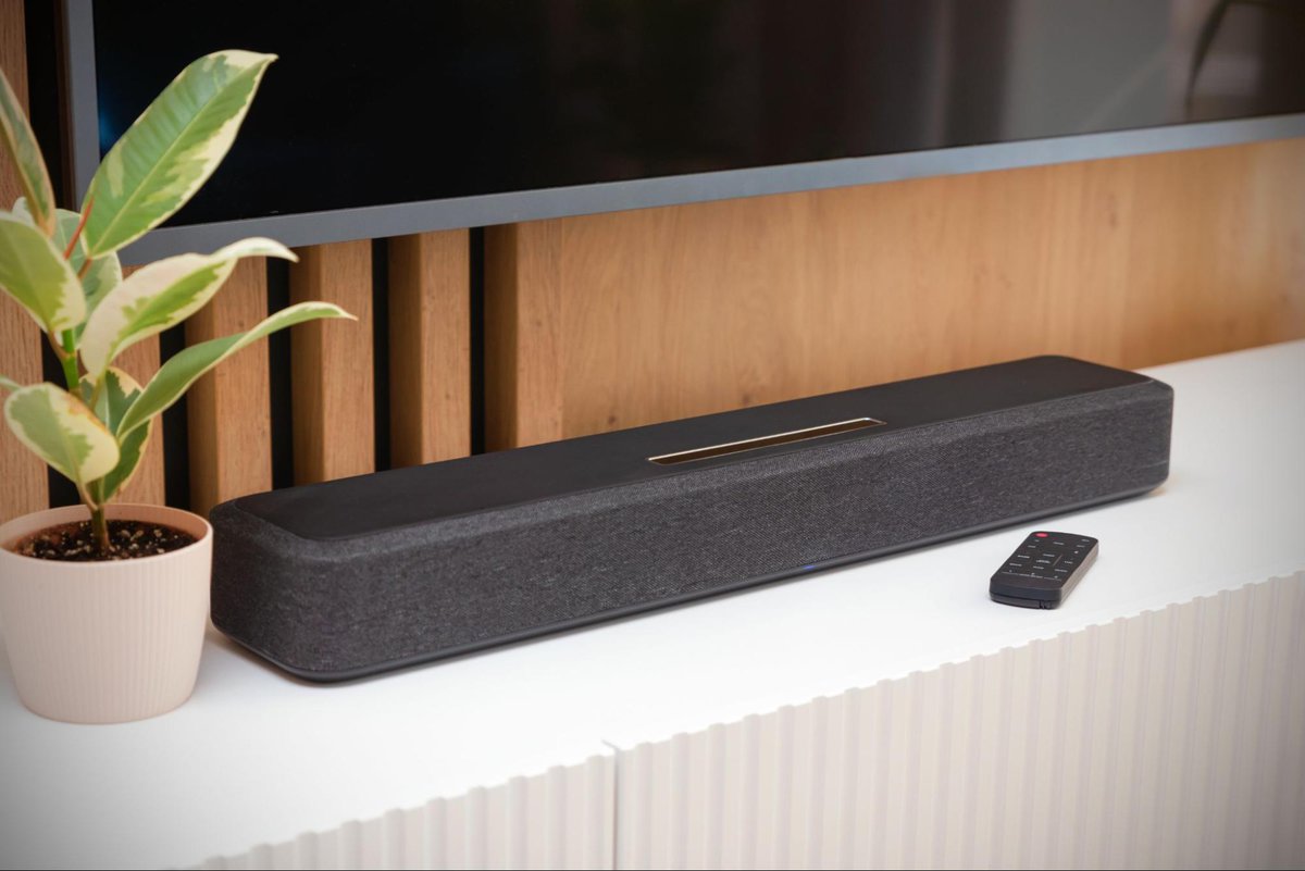 a soundbar under a mounted tv 