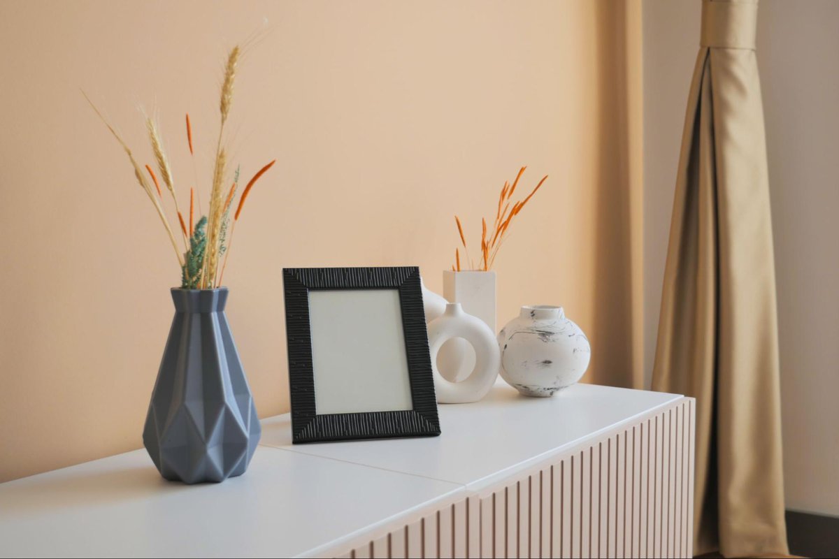 a photo frame with some flower pots