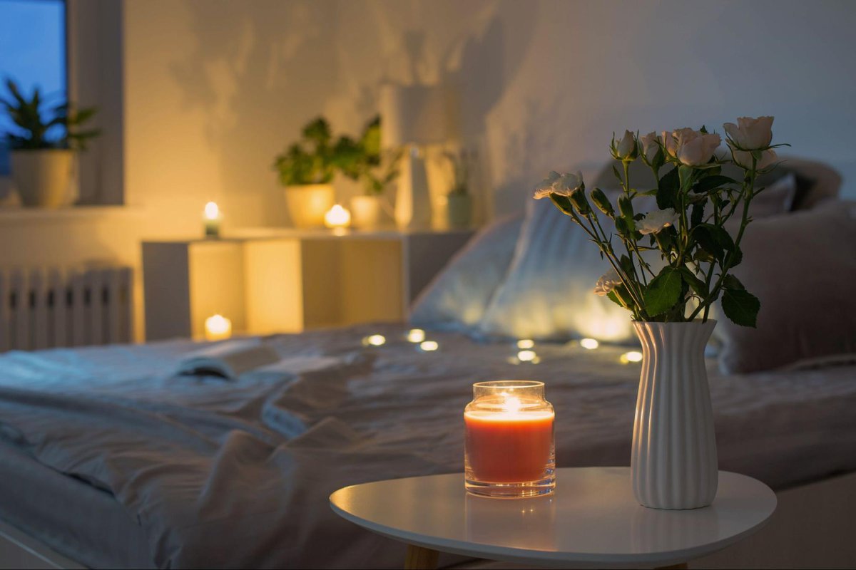 a bedroom with candles